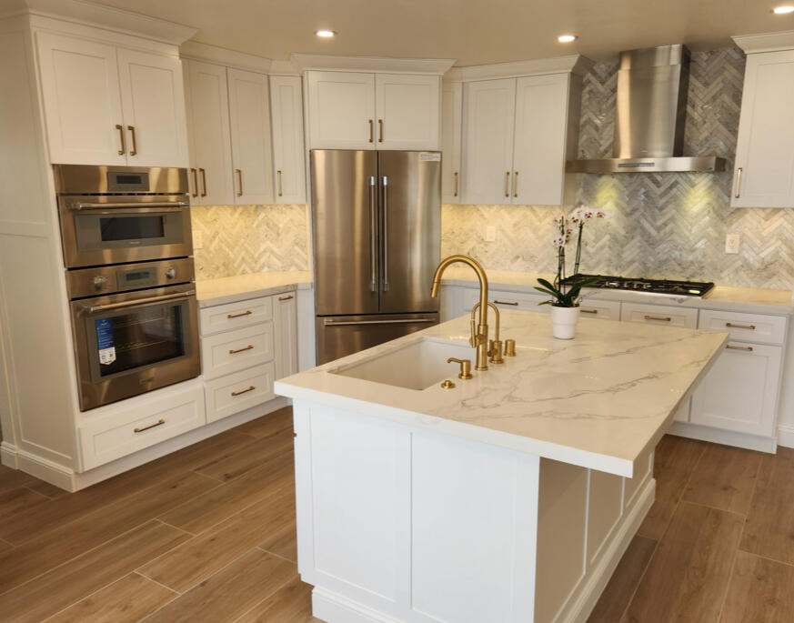 Kitchen remodeling project with updated cabinets, countertops, sink, fixtures, and modern finishes.